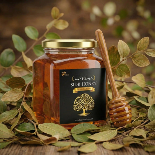 Jar of Sidr Honey with a honey dipper on a leafy background